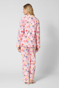 A Lady Wearing Serene Sunrise Long Sleeve Classic Stretch Jersey Pj Set in a back view pose