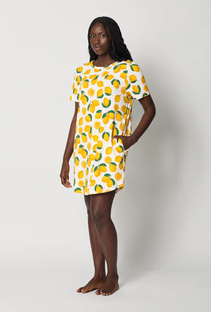 A lady wearing White and  Yellow Stretch Jersey T-Shirt Sleep Dress side view