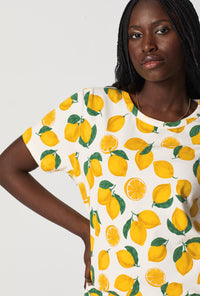 A closeup of A lady wearing White and  Yellow Stretch Jersey T-Shirt Sleep Dress
