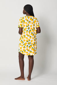 A lady wearing White and  Yellow Stretch Jersey T-Shirt Sleep Dress back view