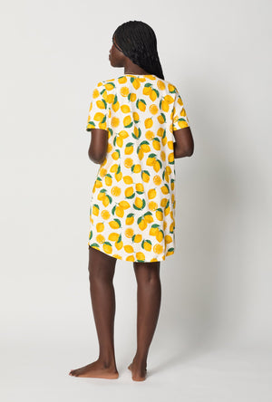 A lady wearing White and  Yellow Stretch Jersey T-Shirt Sleep Dress back view