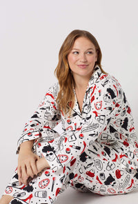 A lady wearing plus size Devil Wears Prada Long Sleeve Classic Stretch Jersey Pj Set closer look sitting