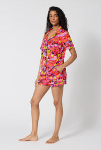 A Lady Wearing Pumpkin Patch Party Short Sleeve Classic Shorty Stretch Jersey Pj Set in a side angled pose