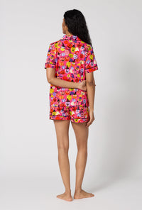 A Lady Wearing Pumpkin Patch Party Short Sleeve Classic Shorty Stretch Jersey Pj Set in a back view pose