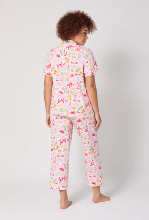 A lady wearing French Quarter Short Sleeve Classic Stretch Jersey Cropped Pj Set