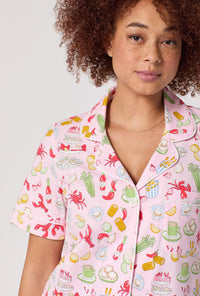 A lady wearing French Quarter Short Sleeve Classic Stretch Jersey Cropped Pj Set