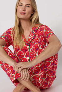 A Lady Wearing Monkeying Around Short Sleeve Classic Stretch Jersey Cropped Pj Set in a close up sitting pose