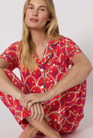 A Lady Wearing Monkeying Around Short Sleeve Classic Stretch Jersey Cropped Pj Set in a close up sitting pose