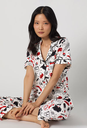 A lady wearing Devil Wears Prada Short Sleeve Classic Stretch Jersey Cropped Pj Set closer look sitting