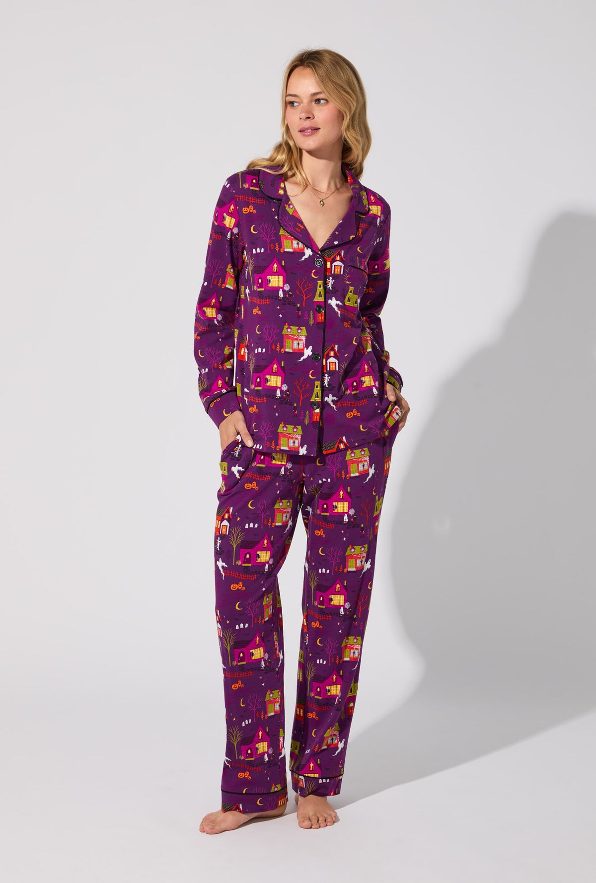 A lady wearing Spooky Town USA Long Sleeve Classic Stretch Jersey PJ Set