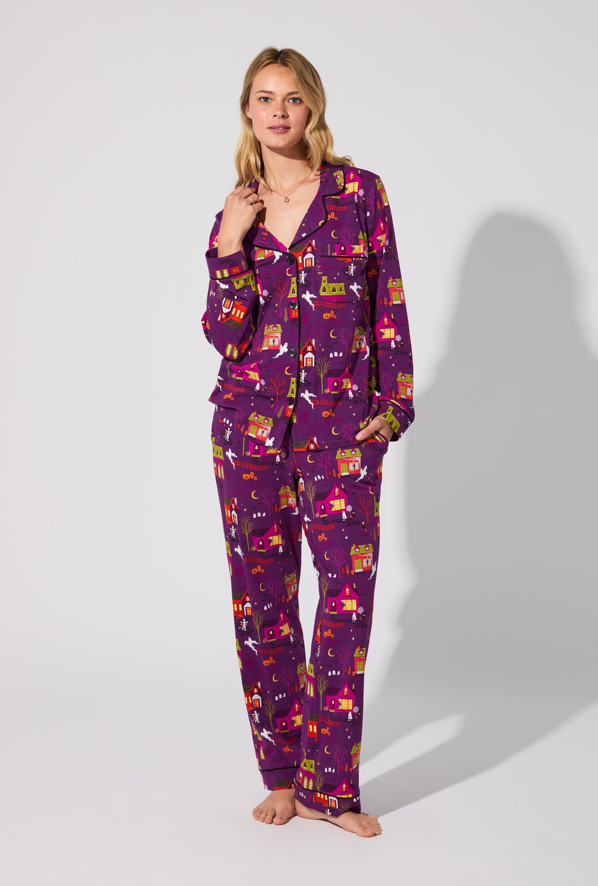 A lady wearing Spooky Town USA Long Sleeve Classic Stretch Jersey PJ Set