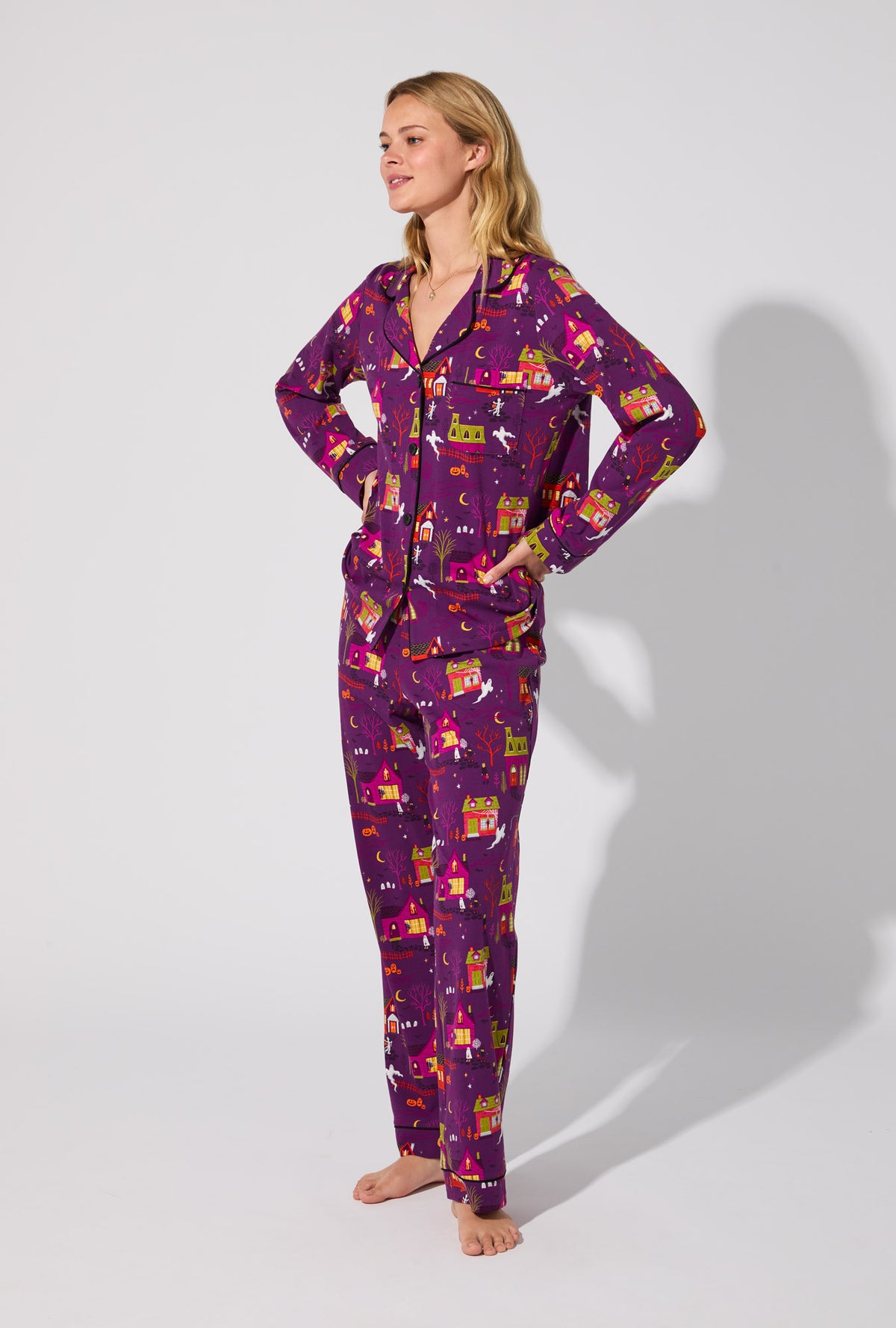 A lady wearing Spooky Town USA Long Sleeve Classic Stretch Jersey PJ Set