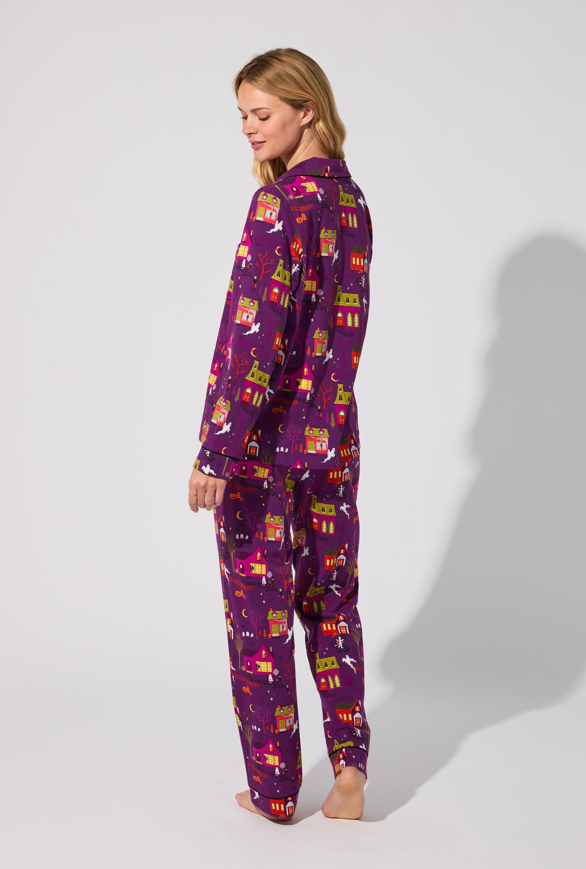 A lady wearing Spooky Town USA Long Sleeve Classic Stretch Jersey PJ Set