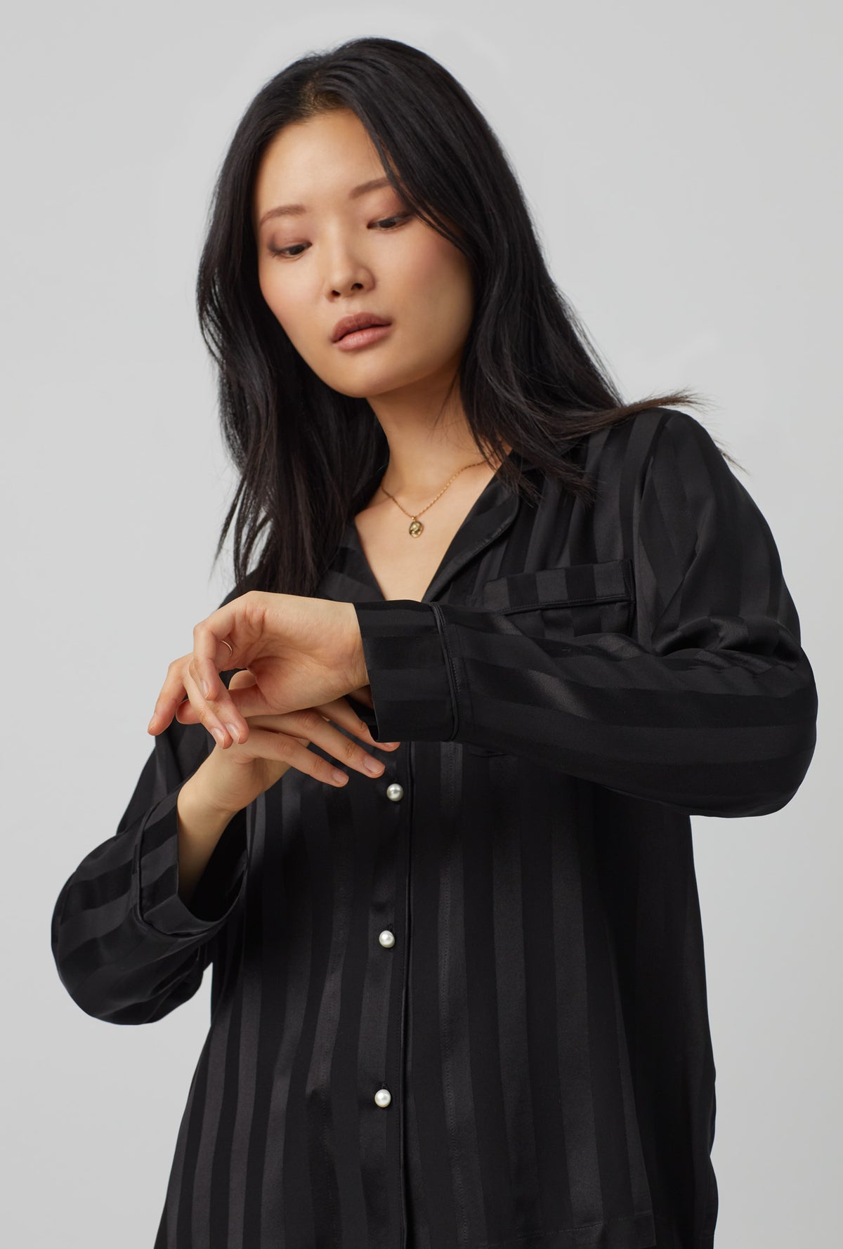A lady wearing black  Long Sleeve Classic Washable Silk Satin PJ Set with Onyx print