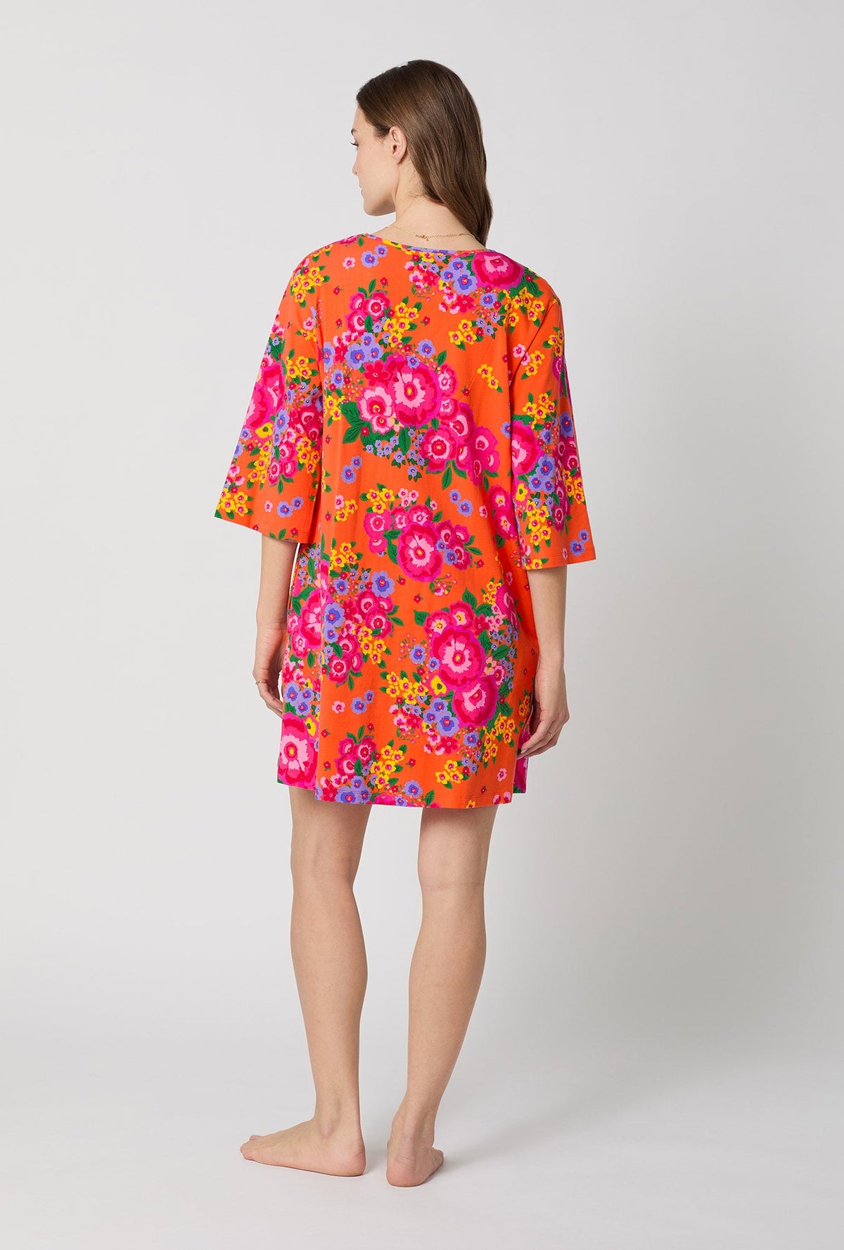 A lady wearing Orange Stretch Jersey Sleep Dress back view
