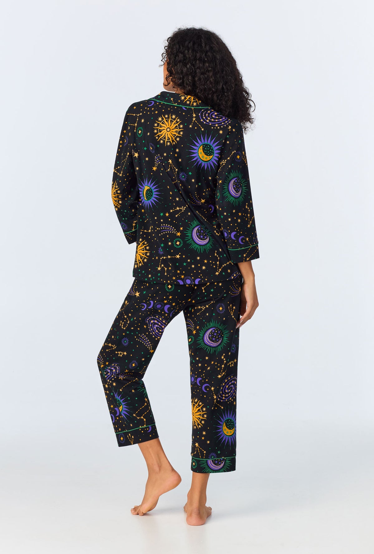 A lady wearing Night Sky 3/4 Sleeve Classic Stretch Jersey Cropped PJ Set