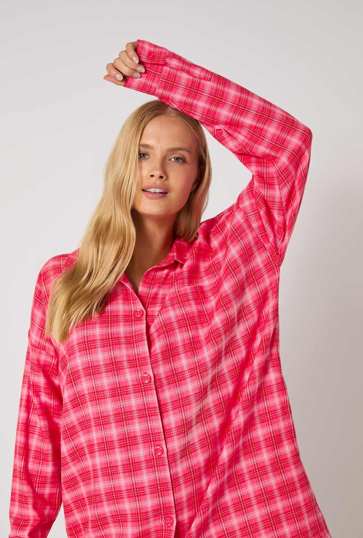 A lady wearing Wonderland Plaid High Low Woven Portuguese Flannel Boyfriend Shirt