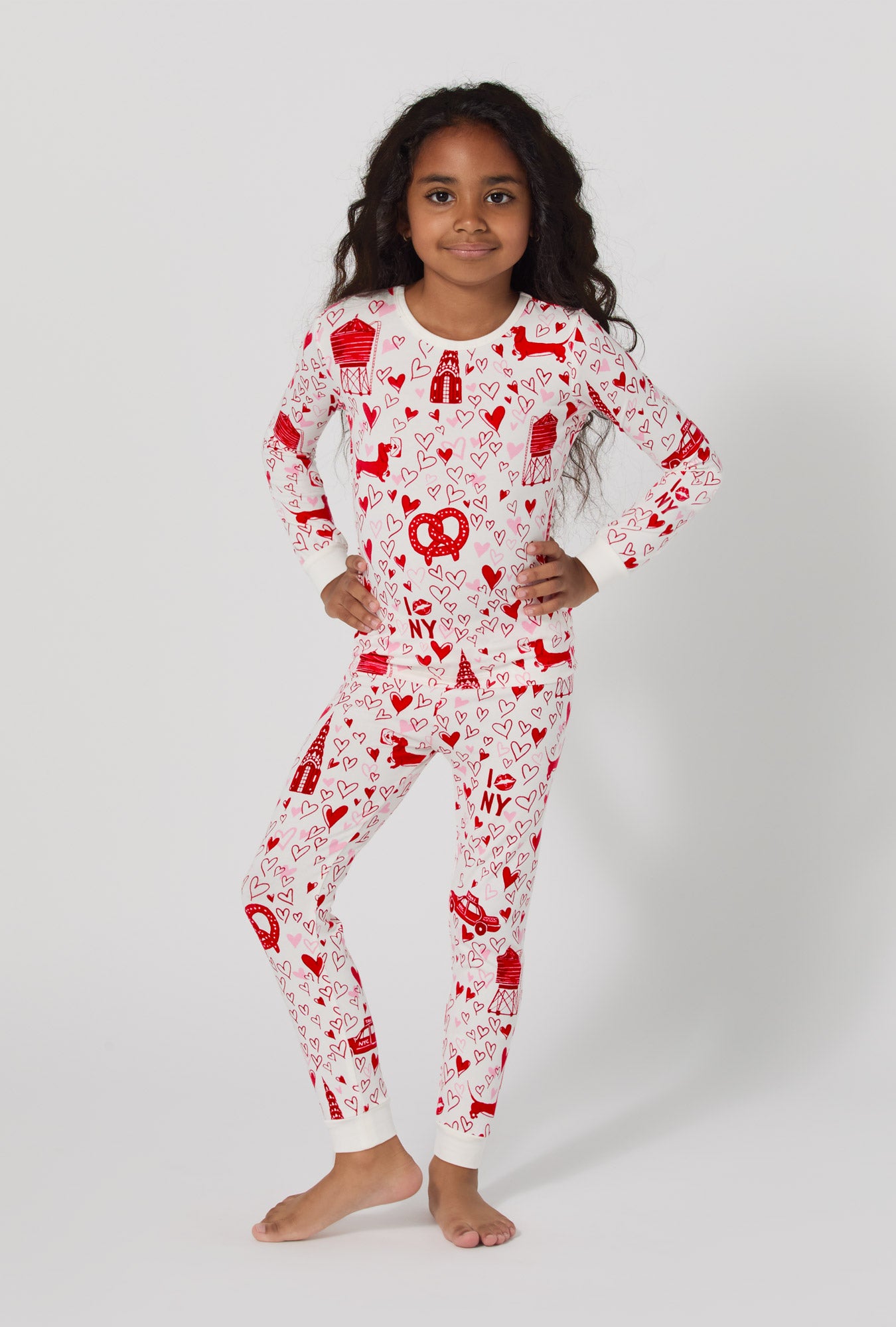 A girl wearing Heart Of The City Long Sleeve Stretch Jersey Kids Pj Set