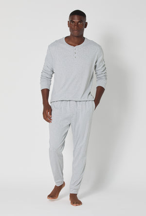 A man wearing True Grey Heather Men's Long Sleeve Henley And Jogger Cotton Rib Pj Set