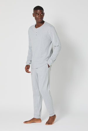 A man wearing True Grey Heather Men's Long Sleeve Henley And Jogger Cotton Rib Pj Set