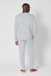 A man wearing True Grey Heather Men's Long Sleeve Henley And Jogger Cotton Rib Pj Set