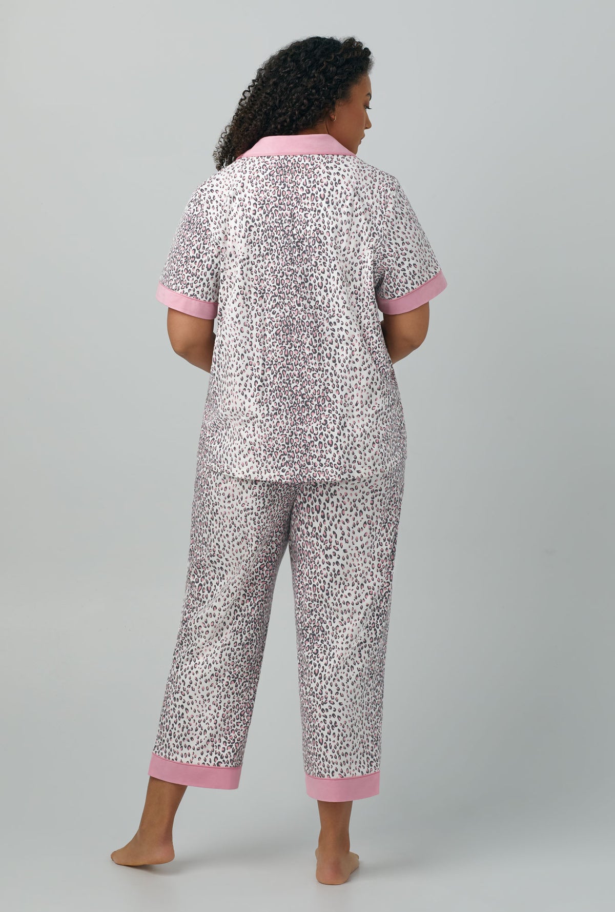 A lady wearing Short Sleeve Classic Stretch Jersey Cropped PJ Set with spa kitten print