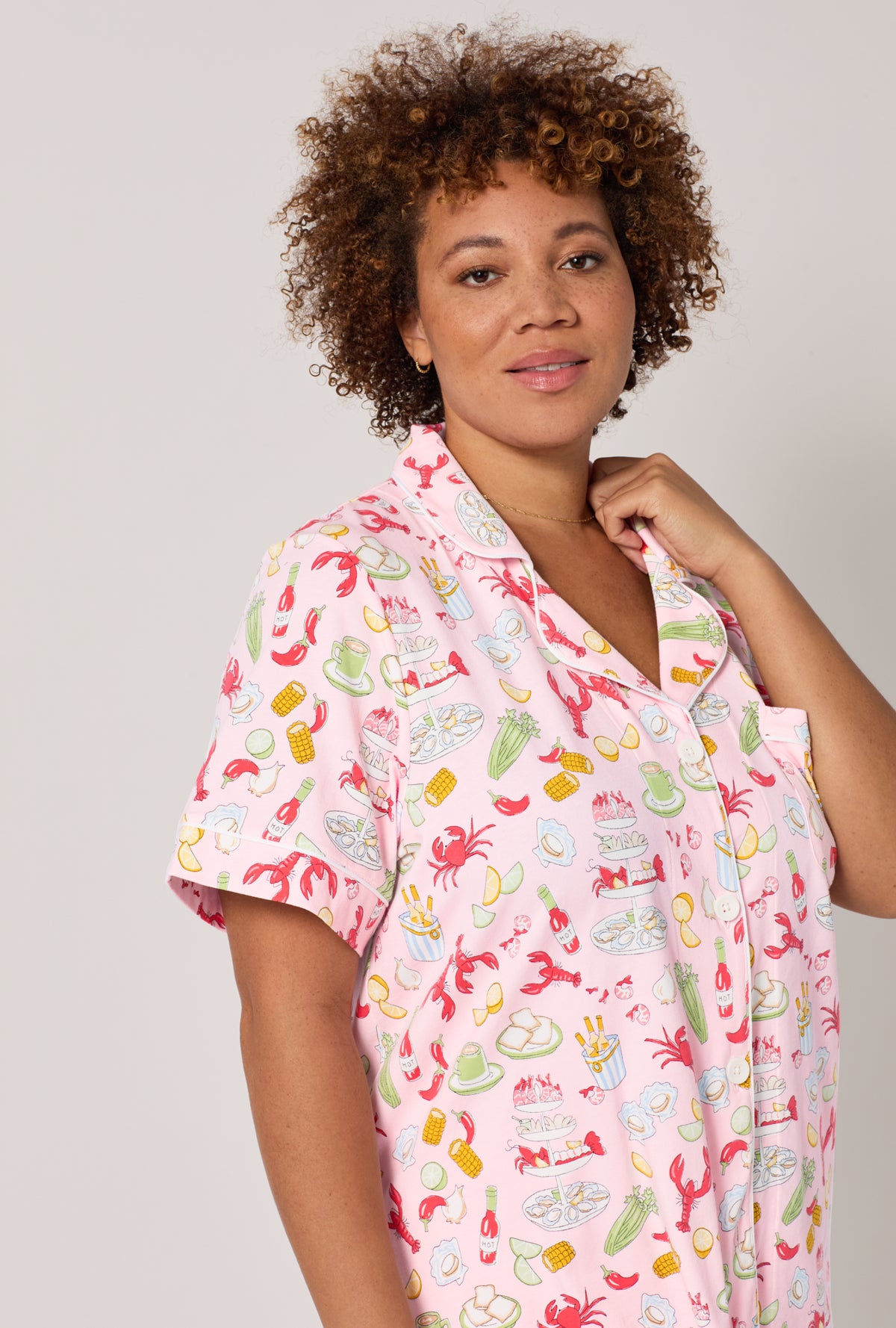 A lady wearing plus size French Quarter Short Sleeve Classic Stretch Jersey Cropped Pj Set
