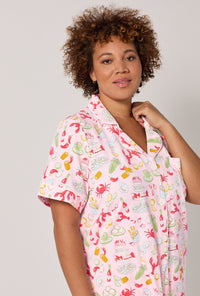 A lady wearing plus size French Quarter Short Sleeve Classic Stretch Jersey Cropped Pj Set