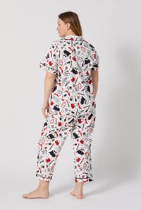 A lady wearing plus size Devil Wears Prada Short Sleeve Classic Stretch Jersey Cropped Pj Set back view