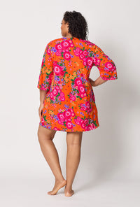 A lady wearing plus size Orange Stretch Jersey Sleep Dress back view