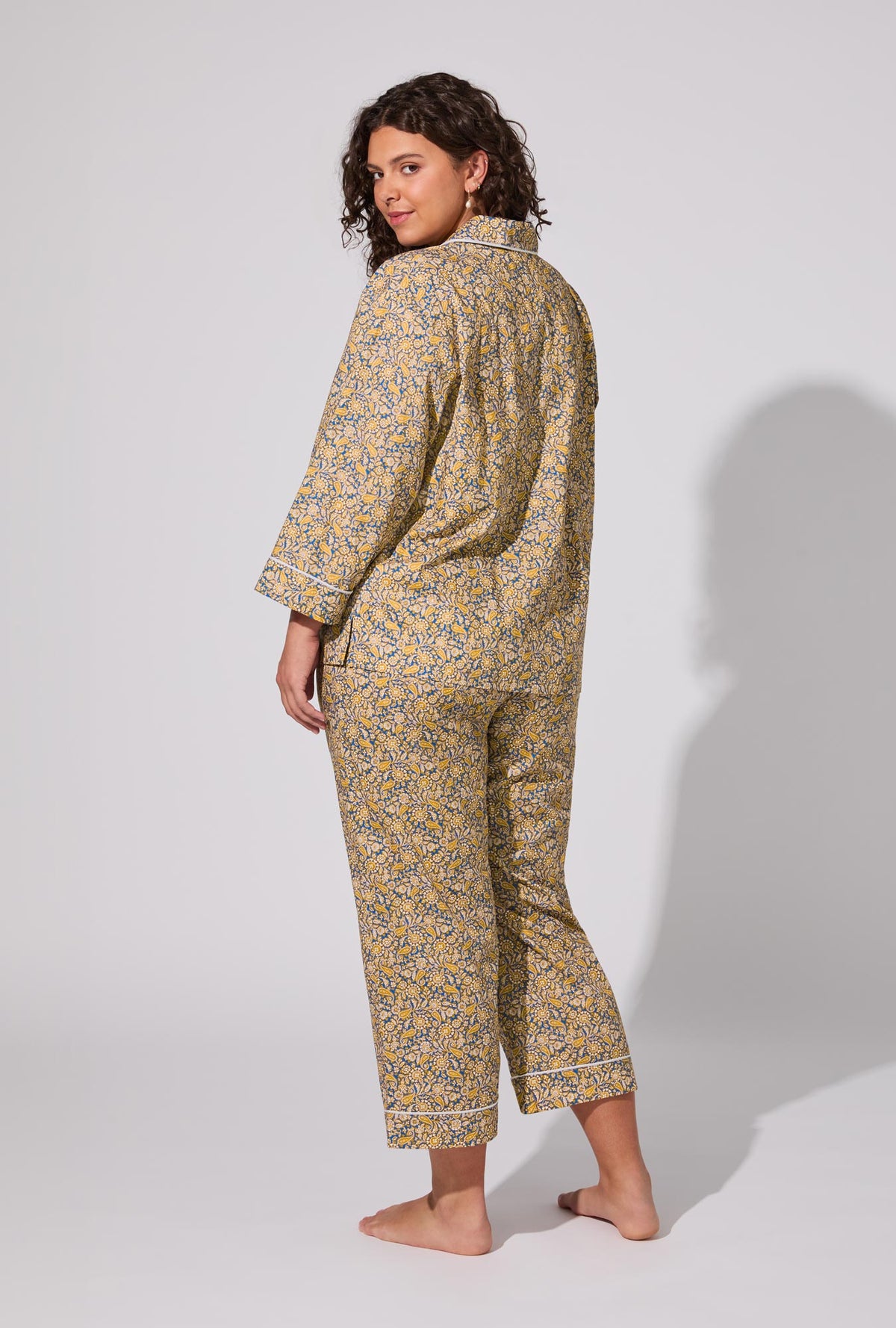 A lady wearing Theodore Manor 3/4 Sleeve Classic Woven Tana Lawn® Cropped PJ set Made With Liberty Fabric