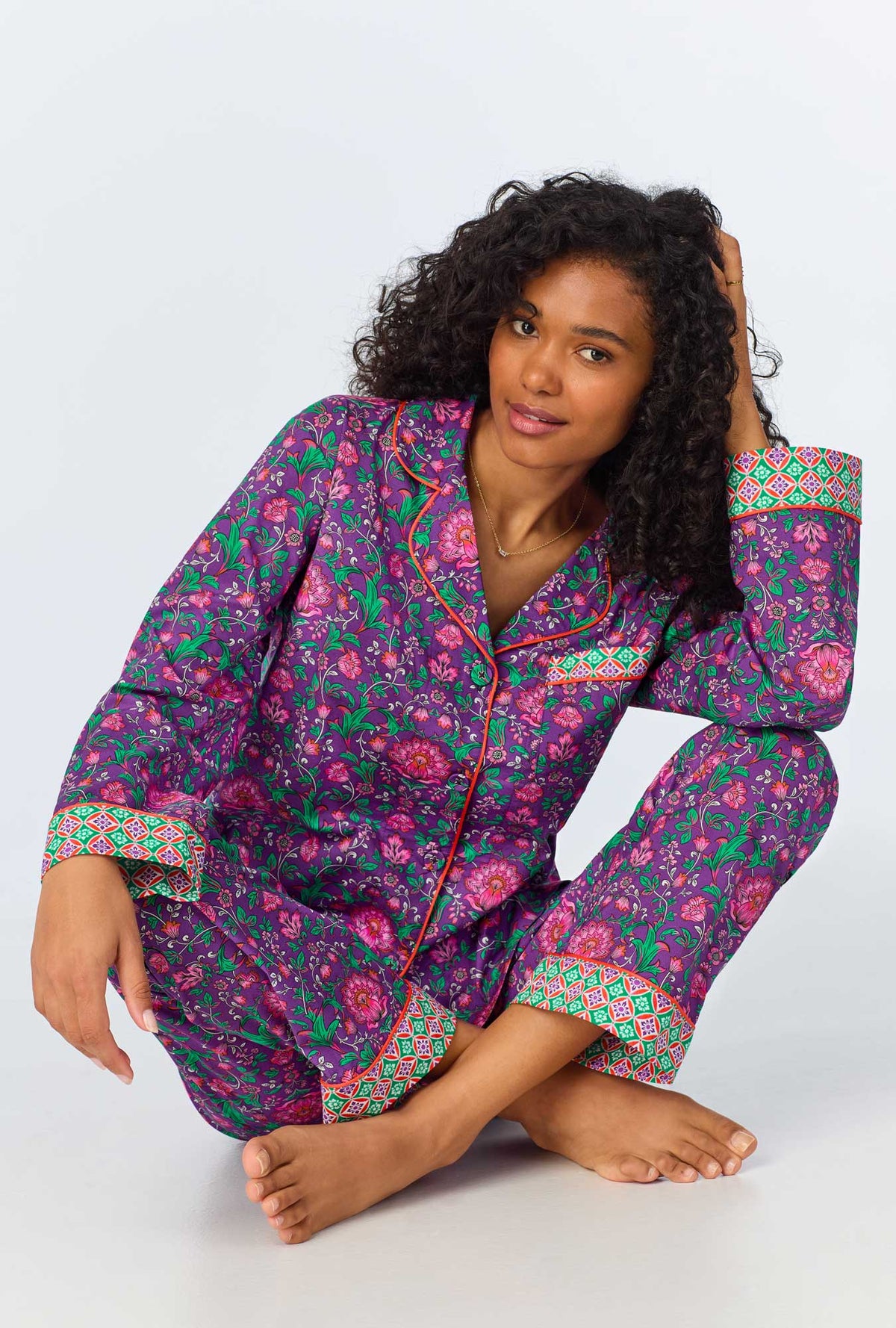 A lady wearing long sleeve classic woven cotton poplin pj set with floral wonderland print