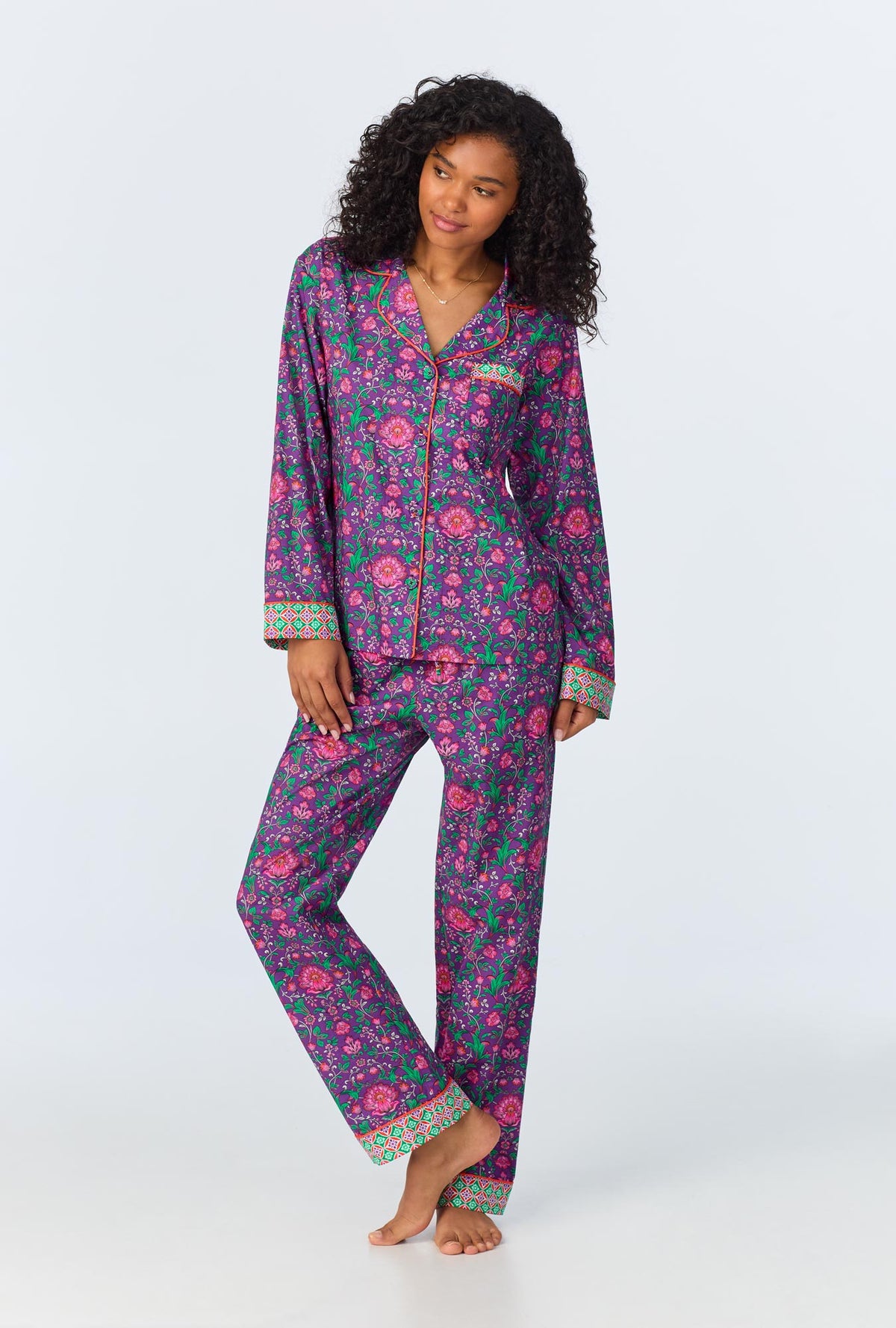 A lady wearing long sleeve classic woven cotton poplin pj set with floral wonderland print