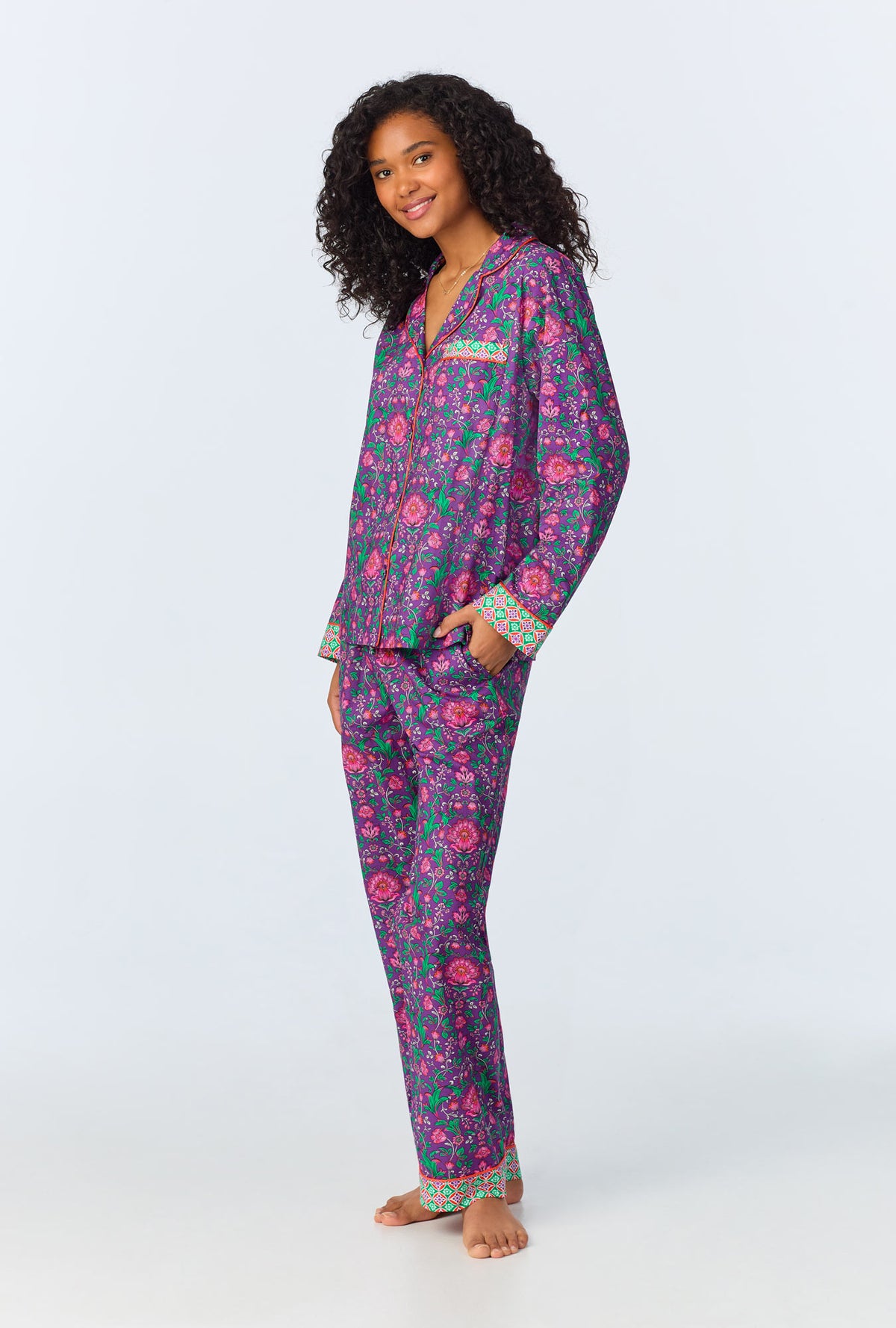 A lady wearing long sleeve classic woven cotton poplin pj set with floral wonderland print