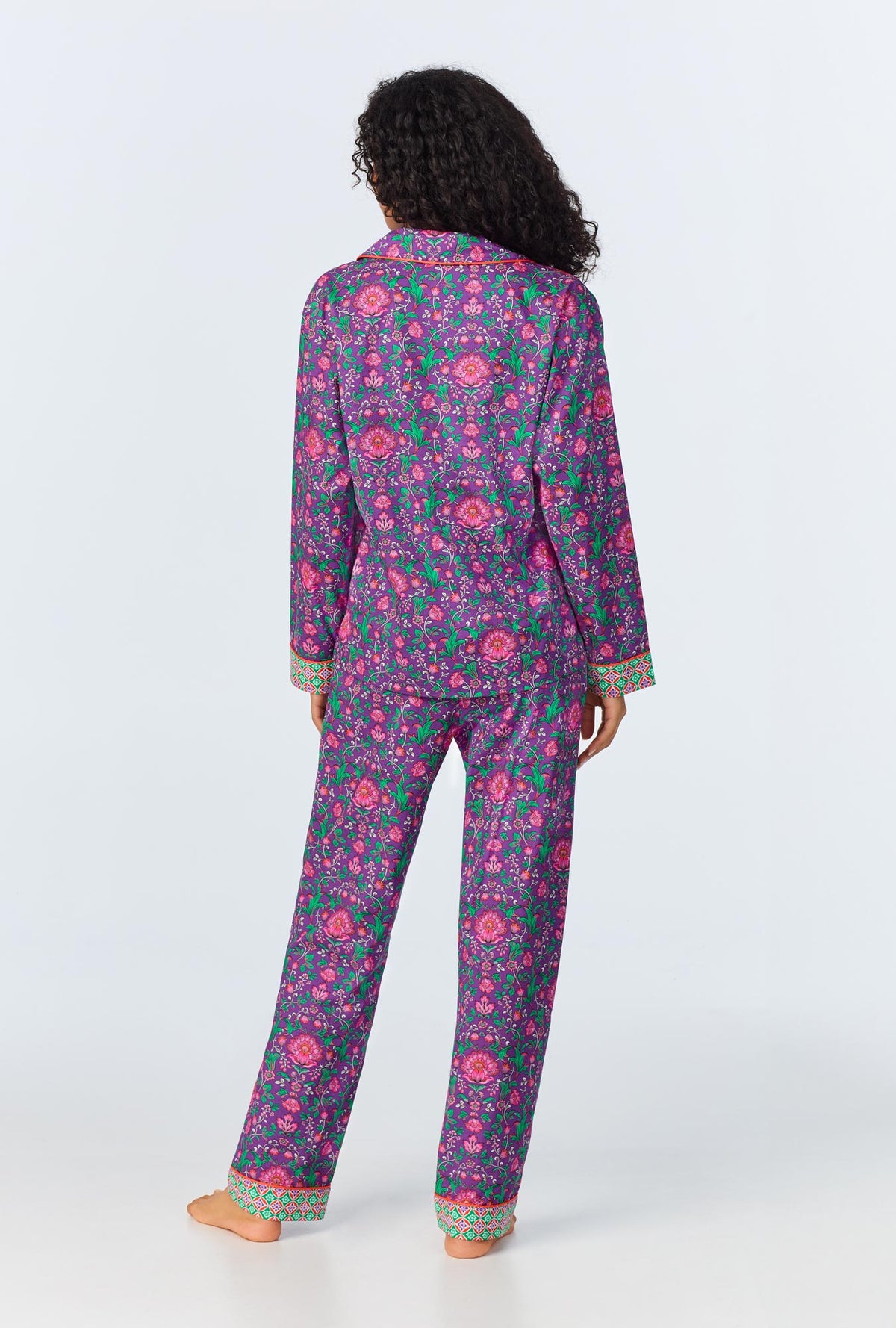 A lady wearing long sleeve classic woven cotton poplin pj set with floral wonderland print