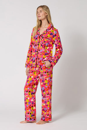 A Lady Wearing Pumpkin Patch Party Long Sleeve Classic Stretch Jersey Pj Set in a side angled pose