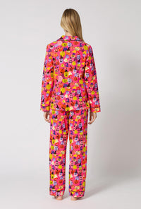 A Lady Wearing Pumpkin Patch Party Long Sleeve Classic Stretch Jersey Pj Set in a back view pose