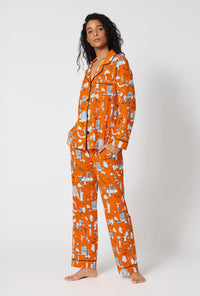 A Lady Wearing Orange Spooky In The City Long Sleeve Classic Stretch Jersey Pj Set in a side angled pose