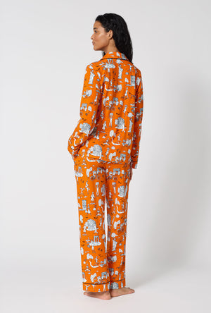 A Lady Wearing Orange Spooky In The City Long Sleeve Classic Stretch Jersey Pj Set in a back view pose