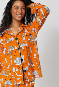A Lady Wearing Orange Spooky In The City Long Sleeve Classic Stretch Jersey Pj Set in a close up view pose