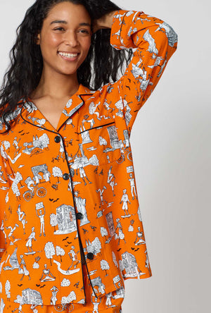A Lady Wearing Orange Spooky In The City Long Sleeve Classic Stretch Jersey Pj Set in a close up view pose