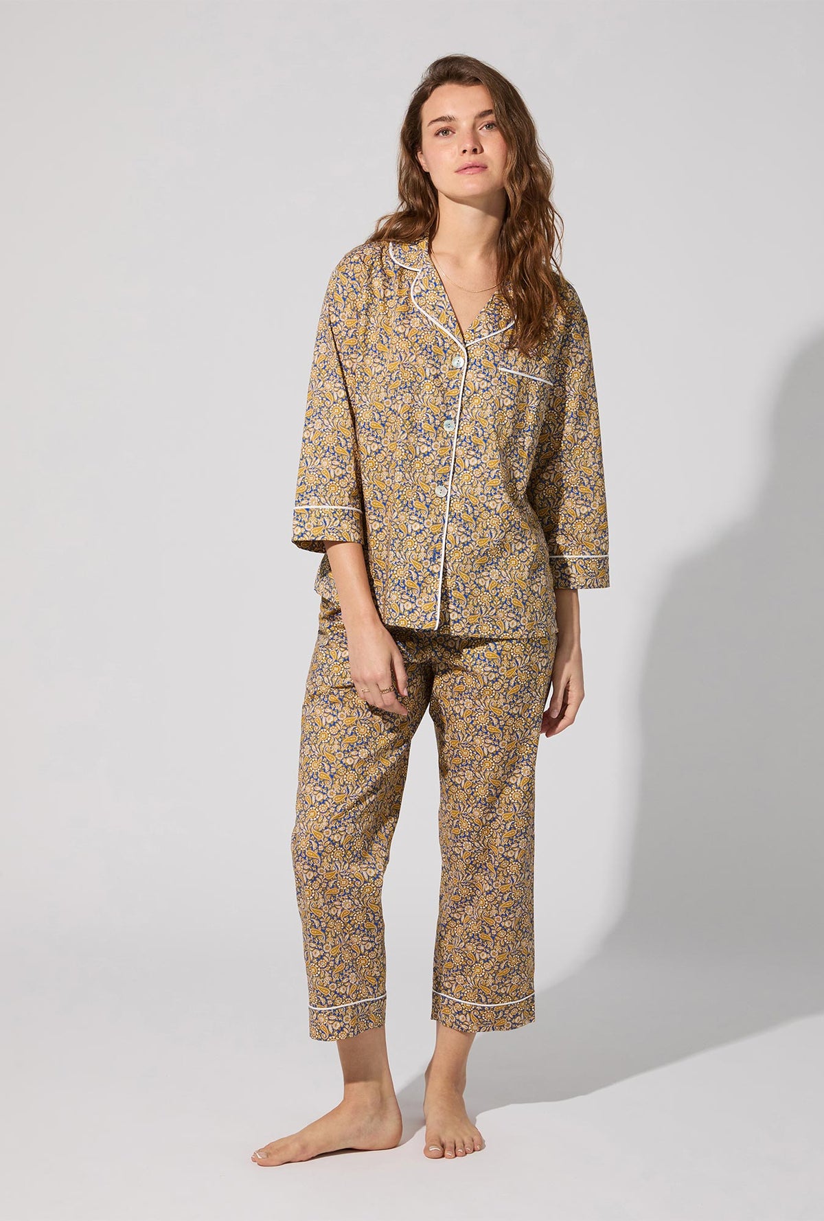 A lady wearing Theodore Manor 3/4 Sleeve Classic Woven Tana Lawn® Cropped PJ set Made With Liberty Fabric