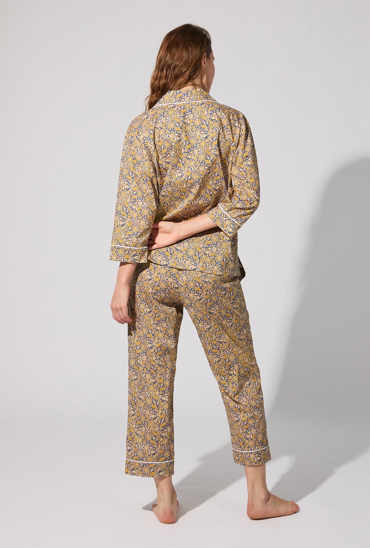 A lady wearing Theodore Manor 3/4 Sleeve Classic Woven Tana Lawn® Cropped PJ set Made With Liberty Fabric