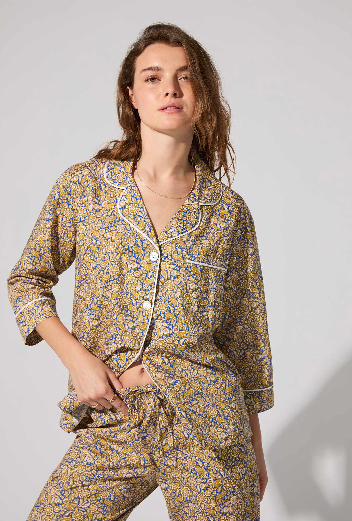 A lady wearing Theodore Manor 3/4 Sleeve Classic Woven Tana Lawn® Cropped PJ set Made With Liberty Fabric