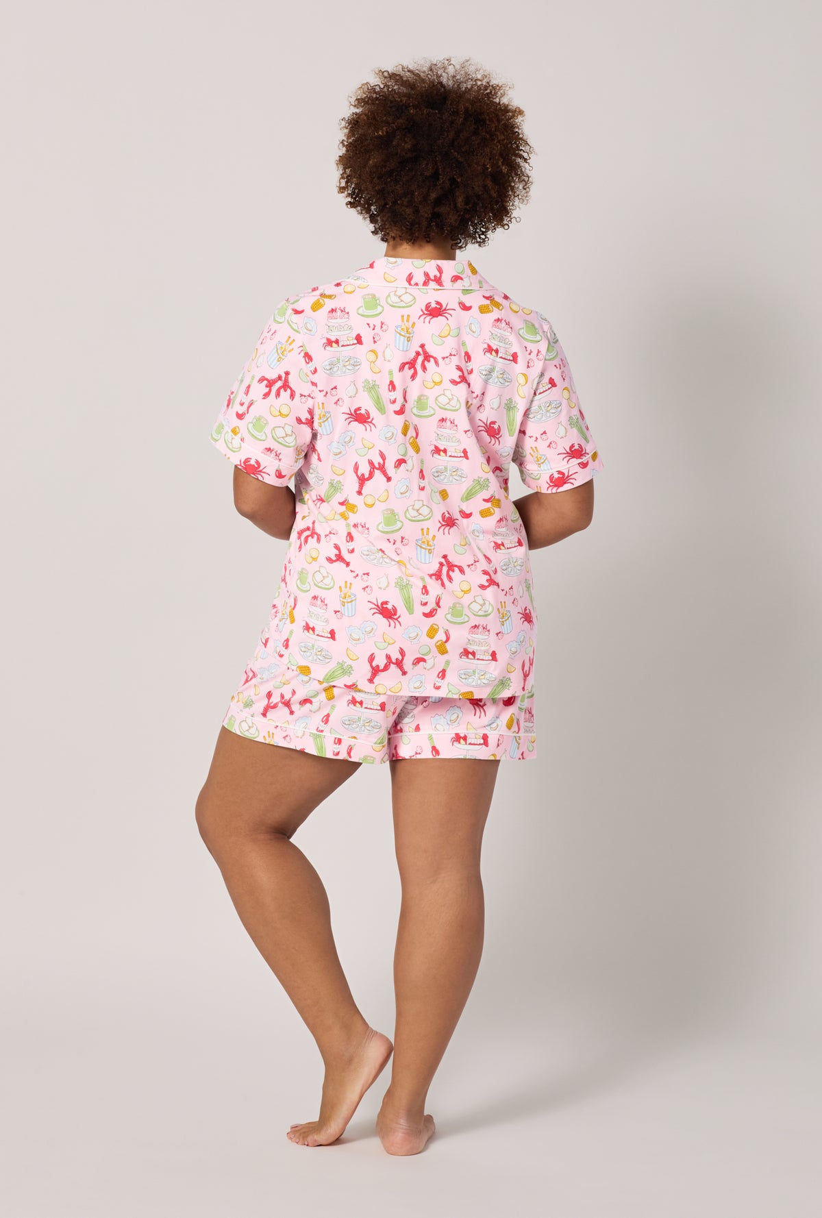 A lady wearing plus size French Quarter Short Sleeve Classic Shorty Stretch Jersey Pj Set