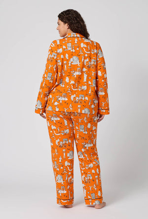 A Lady Wearing Plus Size Orange Spooky In The City Long Sleeve Classic Stretch Jersey Pj Set in a back view pose