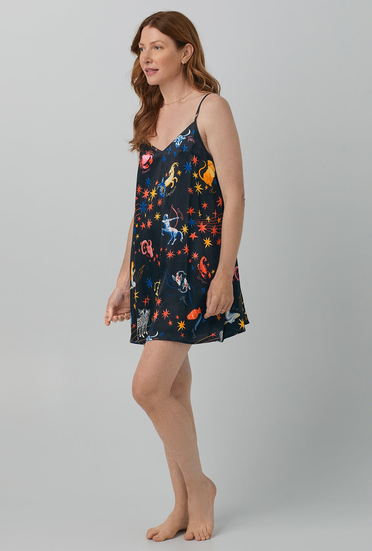 A lady wearing black  Washable Silk Satin Chemise with Celestial Dreams print