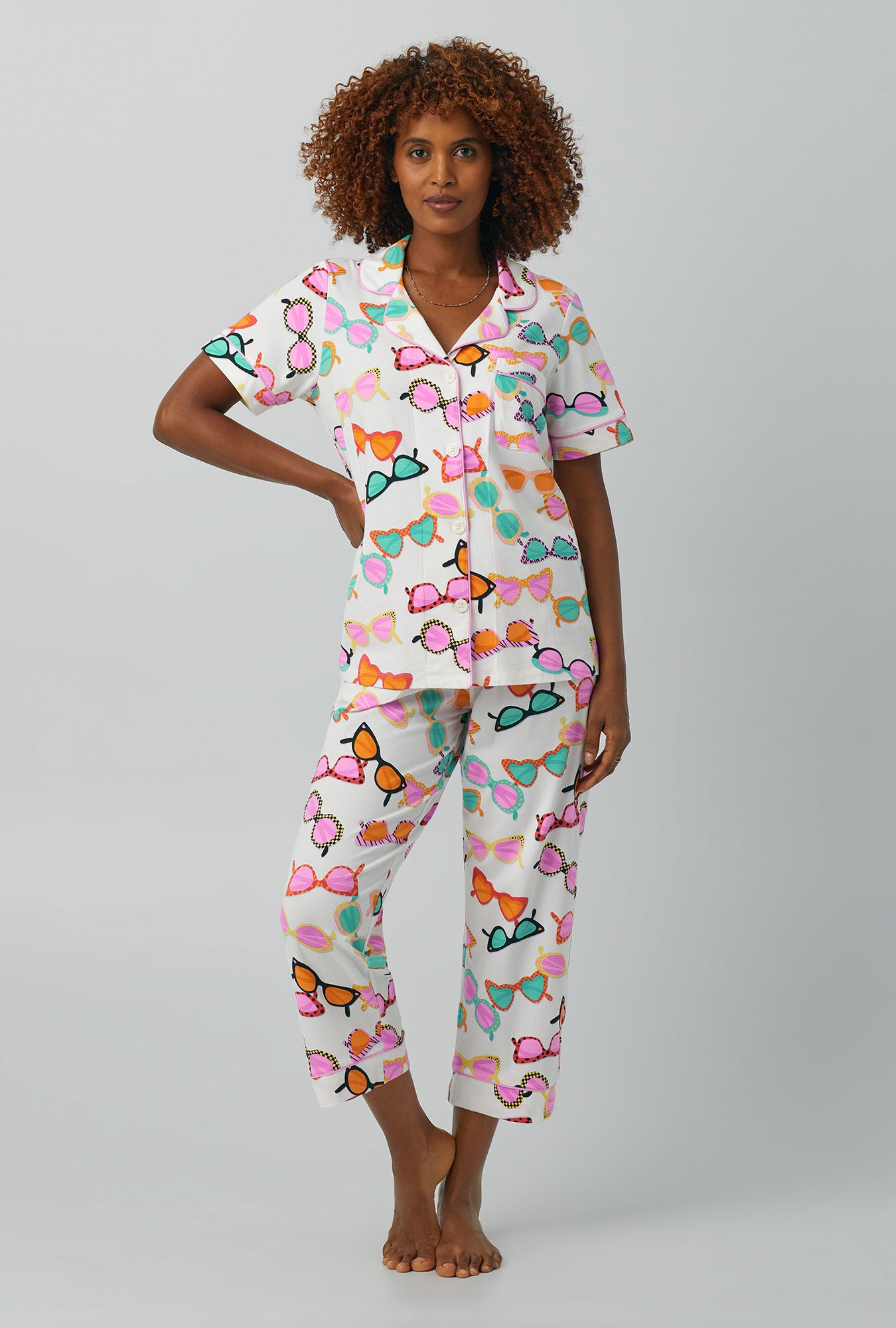 A lady wearing  multi color Short Sleeve Classic Stretch Jersey Cropped PJ Set with Flamingo Bay print