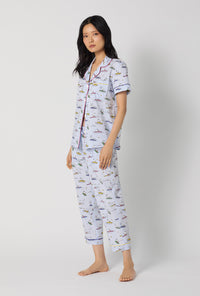 A lady wearing Catch A Wave Snoopy Short Sleeve Classic Woven Cotton Poplin Cropped Pj Set looking side
