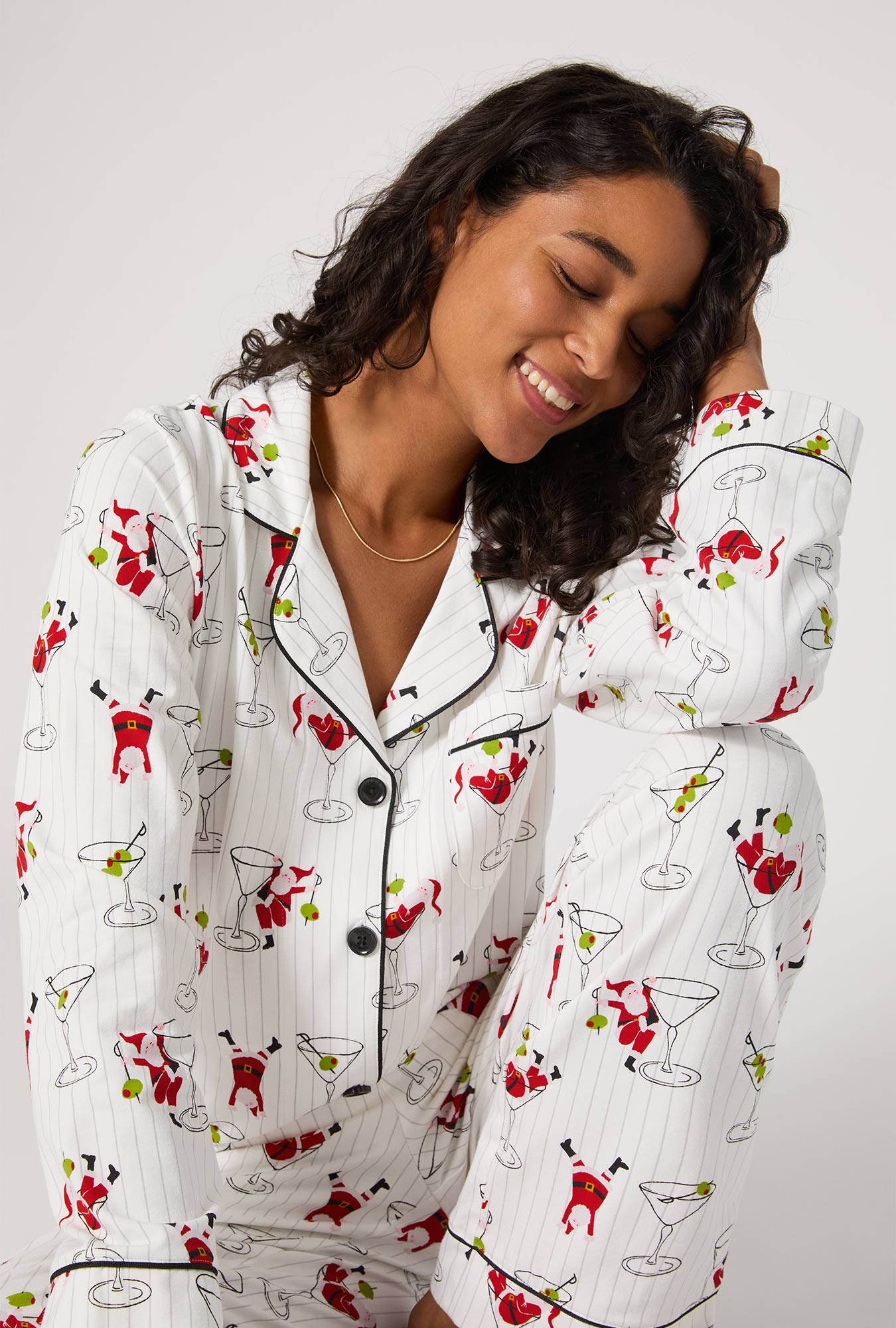 A lady wearing Tipsy Santa Long Sleeve Classic Stretch Jersey Pj Set